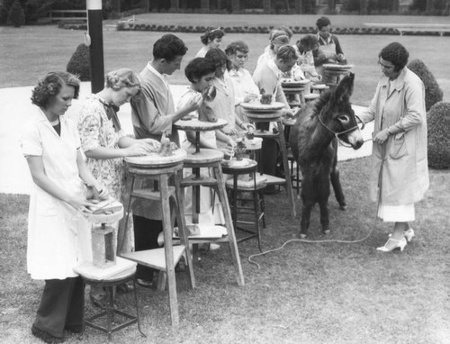 Students sculpting a donkey, view 4