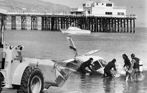 Crashed plane towed from sea