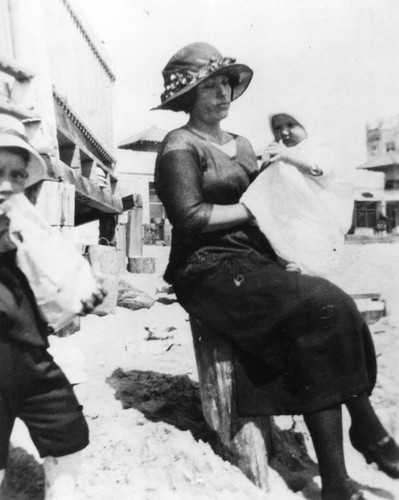 Woman with children at beach