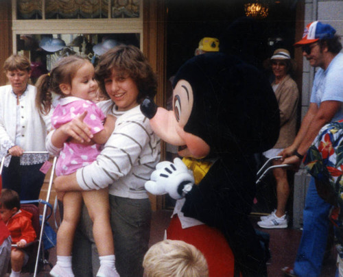 Young girl meets Mickey Mouse