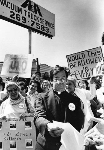 Father Pedro Villaroya with protesters