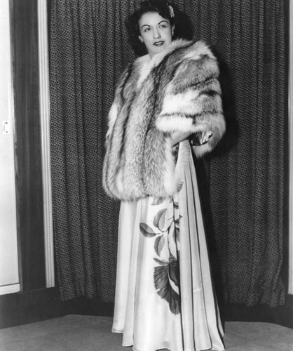 Mildred Burke in a gown and fur