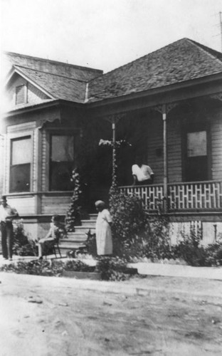 Family in front of house