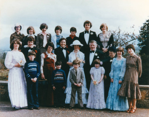 Wedding portrait of newlyweds and family