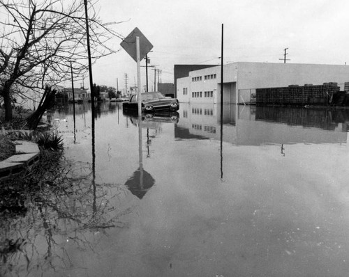 Car stranded in flooded street