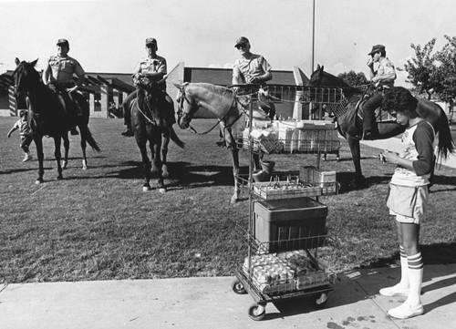 Sheriffs on horseback and businessman