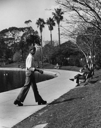 Man walking by lake