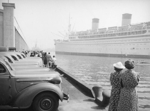 Parked cars and the S.S. Monterey, L. A. Harbor