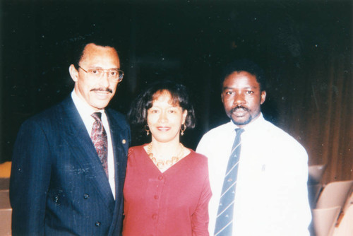 Two men and a woman at a UCLA auditorium