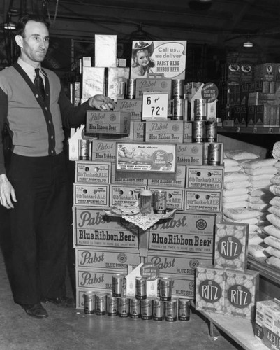 Man at store's beer display