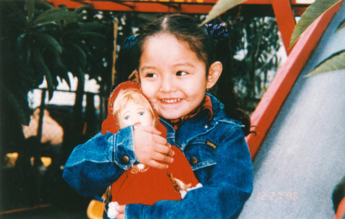 Jocelyn on swings