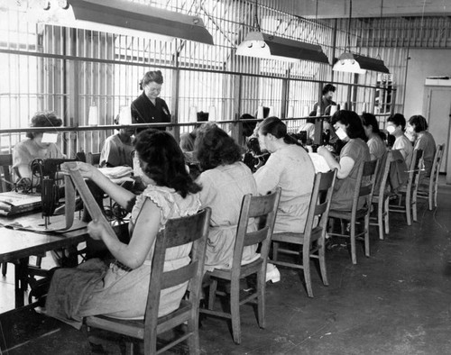 Sgt. Laura Churchill supervises sewing session in prison work room