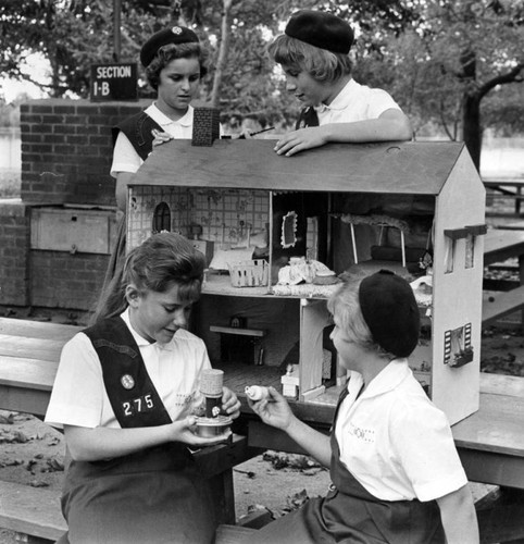 Scouts build doll house to aid center