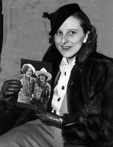 Faith Thomas holding photograph