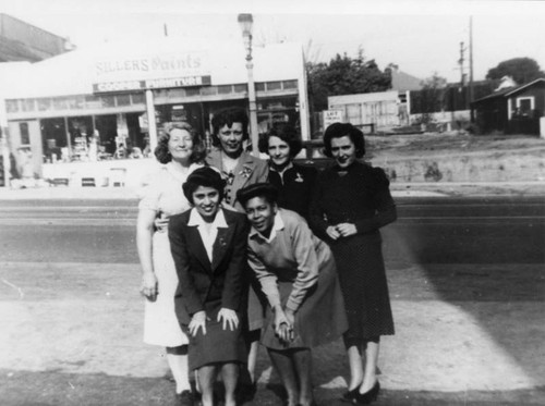 Women pose for photo on Temple Street