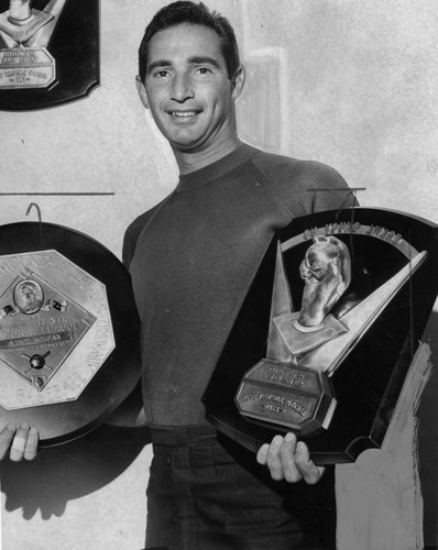 Champion pitcher and his prizes