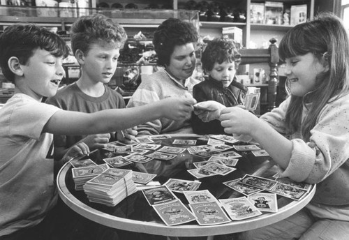 Happy card-traders at a Brentwood candy store