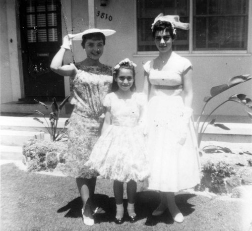 Sisters and cousin dressed for wedding