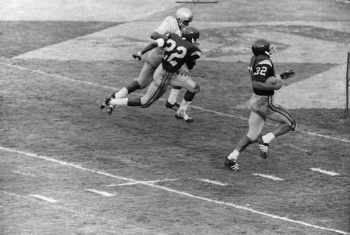 O. J. carries into the end zone