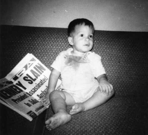 Child with newspaper