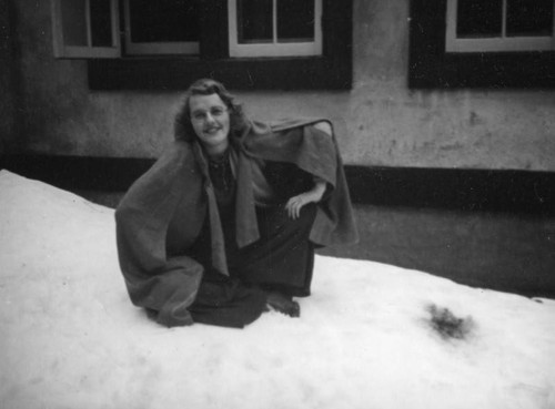 Ethel Schultheis sitting in the snow, Lake Arrowhead