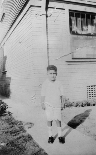 Boy outside home