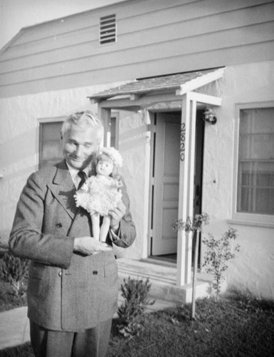 Herman Schultheis with doll