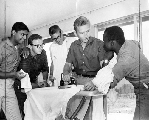 Students pitch in to do the morning ironing