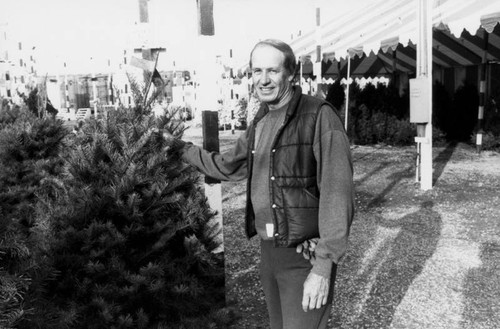 Man with a Christmas tree