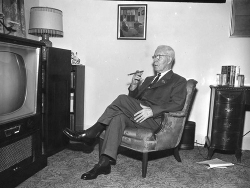 Man in front of TV set