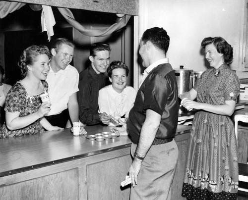 Canoga juniors serve drinks