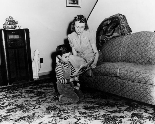 Mother and son in their Ramona Gardens apartment