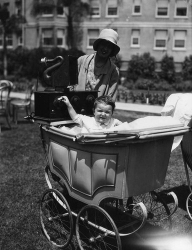 Woman, baby and portable radio