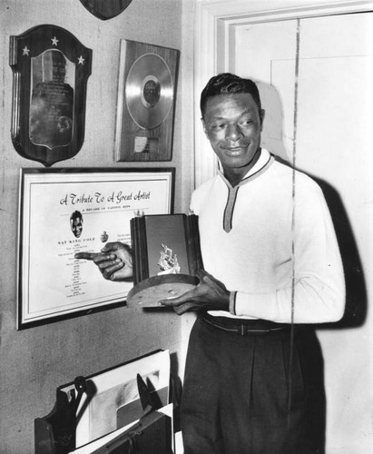 Cole, with some of his awards