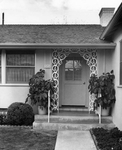 Wrought iron design at entranceway of house