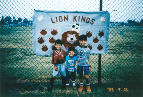 Young soccer player with brothers