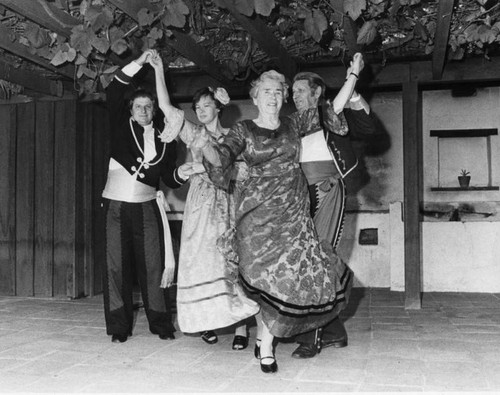 Clayton and Ruiz dance with unidentified women