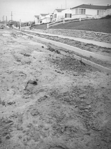 L.A. River flooding, mud packed street in North Hollywood