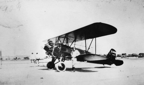 Pilot with airplane