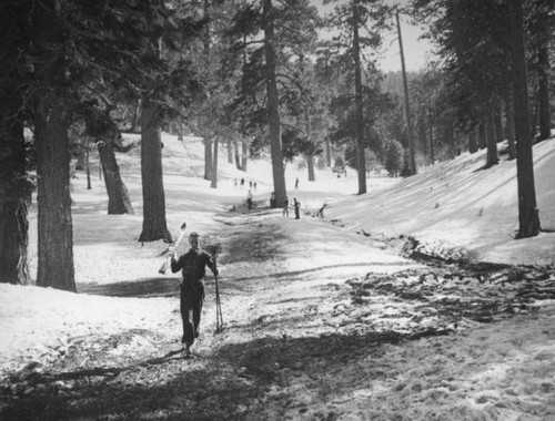 Big Pines Recreation Camp, skier on a muddy trail