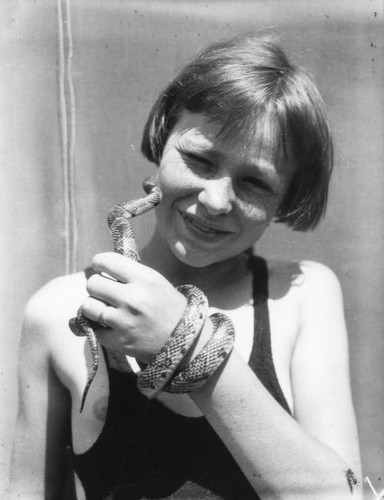 Girl holding snake