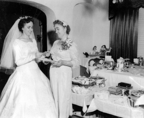 Bride and her mother with wedding gifts