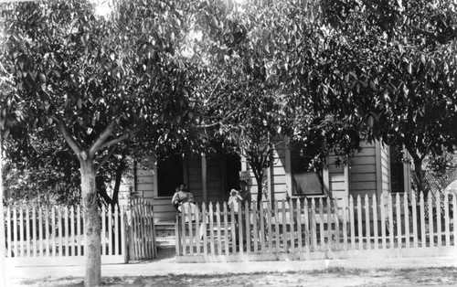 Women and baby on front porch