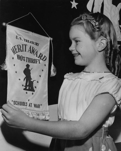 Young girl buys her 9th war bond