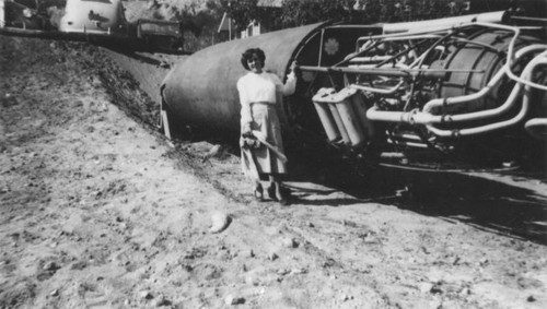 Woman next to rocket engine