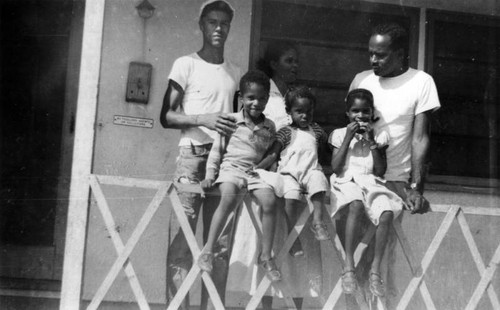 Family in front of home