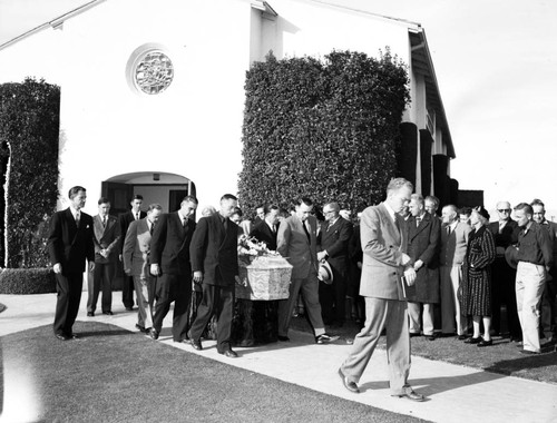 Pall bearers carry May Kovar's casket