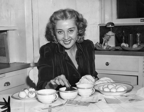 Joan Blondell in kitchen