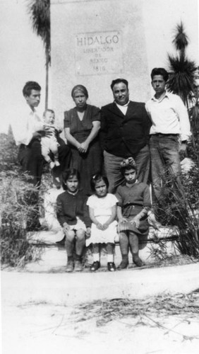 Mexcian American family in front of monument