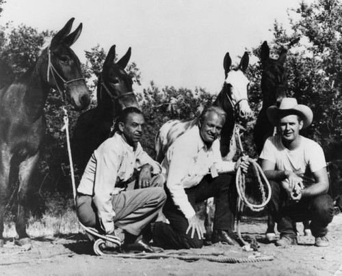 Three men with horses